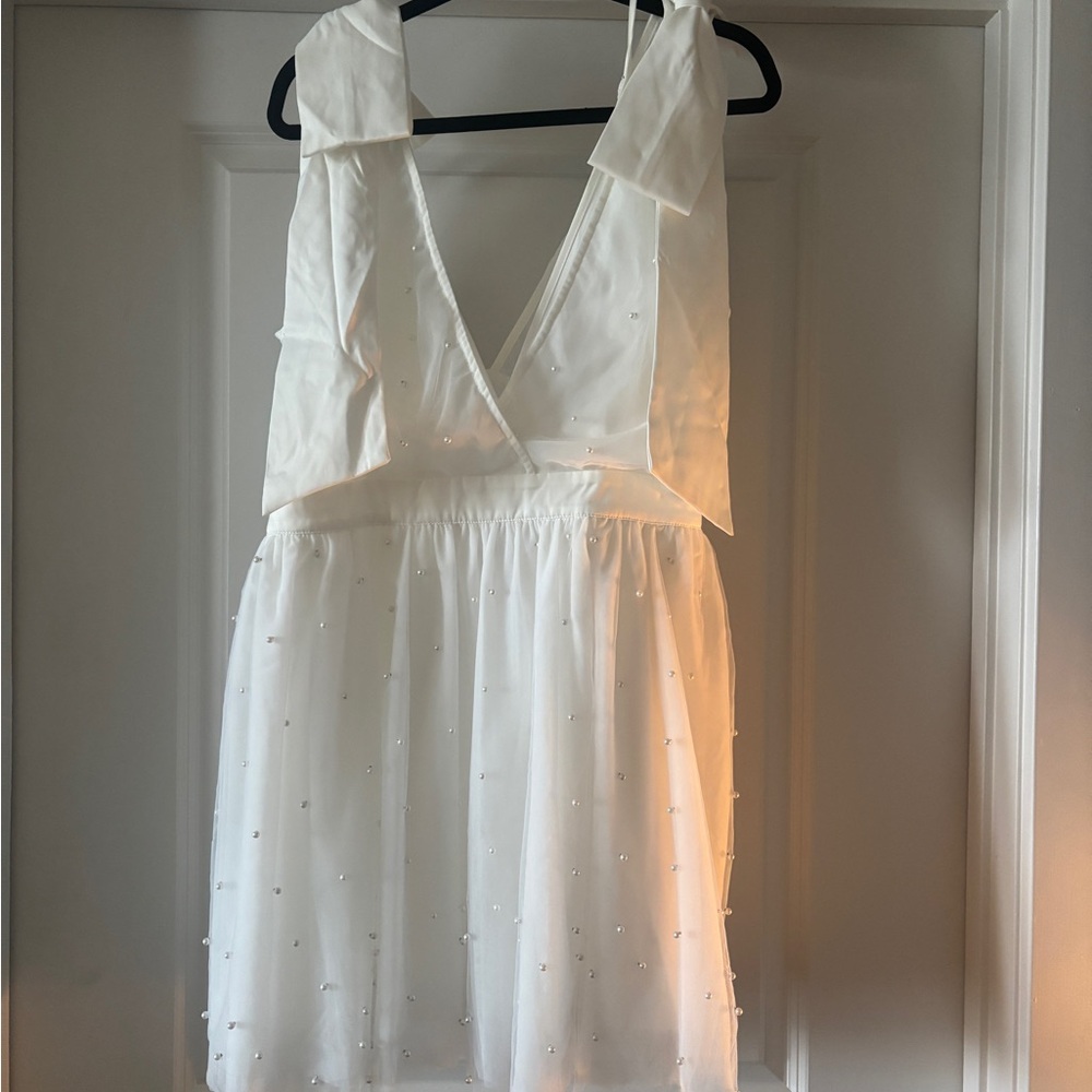 Showpo Karalyn Mini Dress Bow Strap Plunge Pearl Detail Dress in White